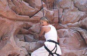 News Room : Charlize Theron overcomes her fear of heights as she scales climbing wall set into a giant billboard in Times Square to promote new film