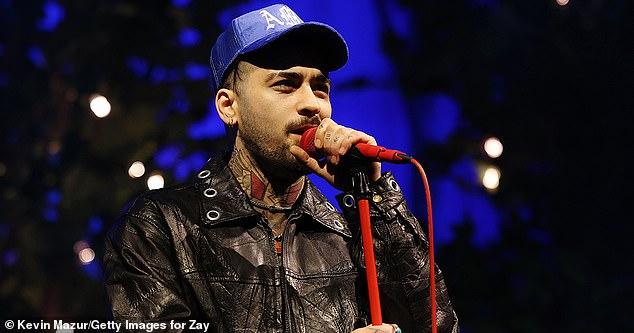 News Room : Zayn Malik has water bottles thrown at