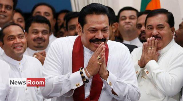 Sri Lanka's newly appointed Prime Minister Rajapaksa gestures during the ceremony to assume duties at the Prime Minister office in Colombo
