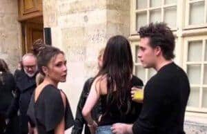 News Room : Another awkward moment between Victoria Beckham and Nicola Peltz goes viral as fans claim Brooklyn’s mum ‘is not the problem’ Discussions among stylish young adults at an outdoor event in a historic city setting.