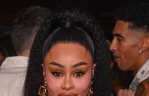 News Room : Blac Chyna accuses ex Twin Hector of spitting on and choking her while her two kids slept feet away Stunning woman in stylish black dress with fur accents at a social event in Sri Lanka.