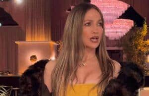 News Room : Jennifer Lopez pokes fun at her ex Ben Affleck’s couple nickname as she glams up for Golden Globes promo Elegant woman in a yellow dress and fur jacket at a glamorous event, holding a handbag and sunglasses.