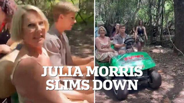 News Room : Julia Morris stuns I'm A Celebrity... Get Fat woman riding in an open car in the forest during daytime.