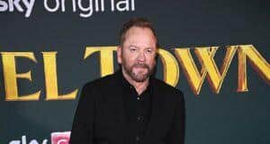 Elegant man in black suit at a red carpet event for a movie premiere in Sri Lanka.