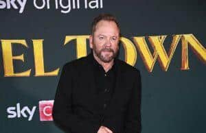 Elegant man in black suit at a red carpet event for a movie premiere in Sri Lanka.