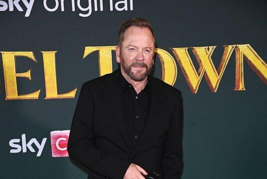 Elegant man in black suit at a red carpet event for a movie premiere in Sri Lanka.