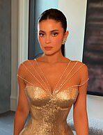News Room : Kylie Jenner and Ariana Grande bring old Hollywood glamour on Golden Globes 2026 red carpet alongside Selena Gomez and Kate Hudson Glamorous woman in gold dress at a formal event.