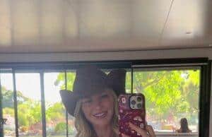 News Room : Lachie who? Jules Neale shows off her revenge bikini body and delivers a brutal swipe at her estranged husband as she relishes in single life following split and affair scandal Vibrant woman in polka dot swimsuit and cowboy hat taking mirror selfie indoors at bright, modern space.