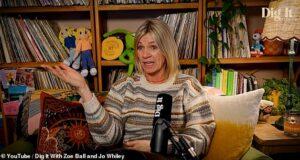 A woman speaking during interview with bookshelf background, colorful toys, and decor.