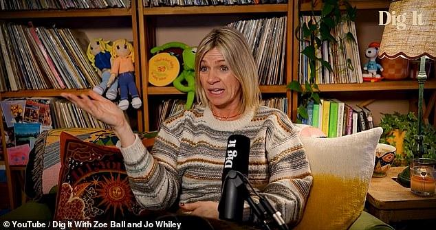 News Room : Zoe Ball reflects on 'tricky' journey to A woman speaking during interview with bookshelf background, colorful toys, and decor.